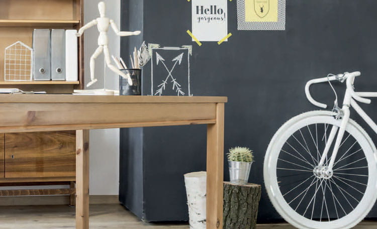 room interior with white bicycle, desk and files