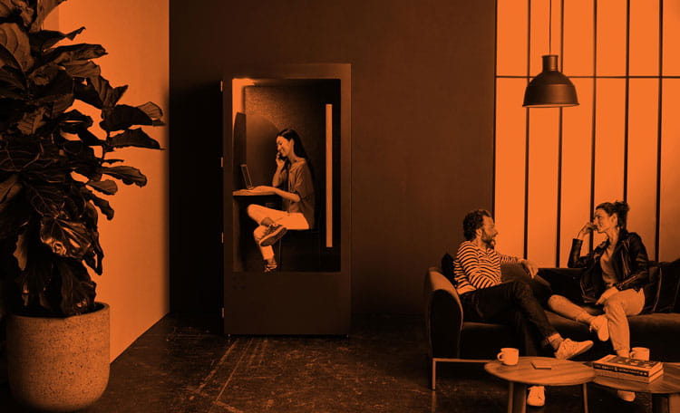 Orange duotone of workers on sofas talking informally