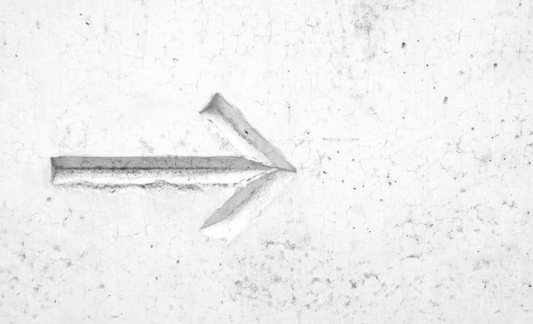 arrow engraved in concrete